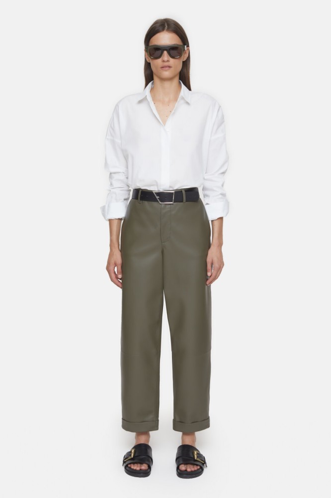 Closed white shirt and olive green pants