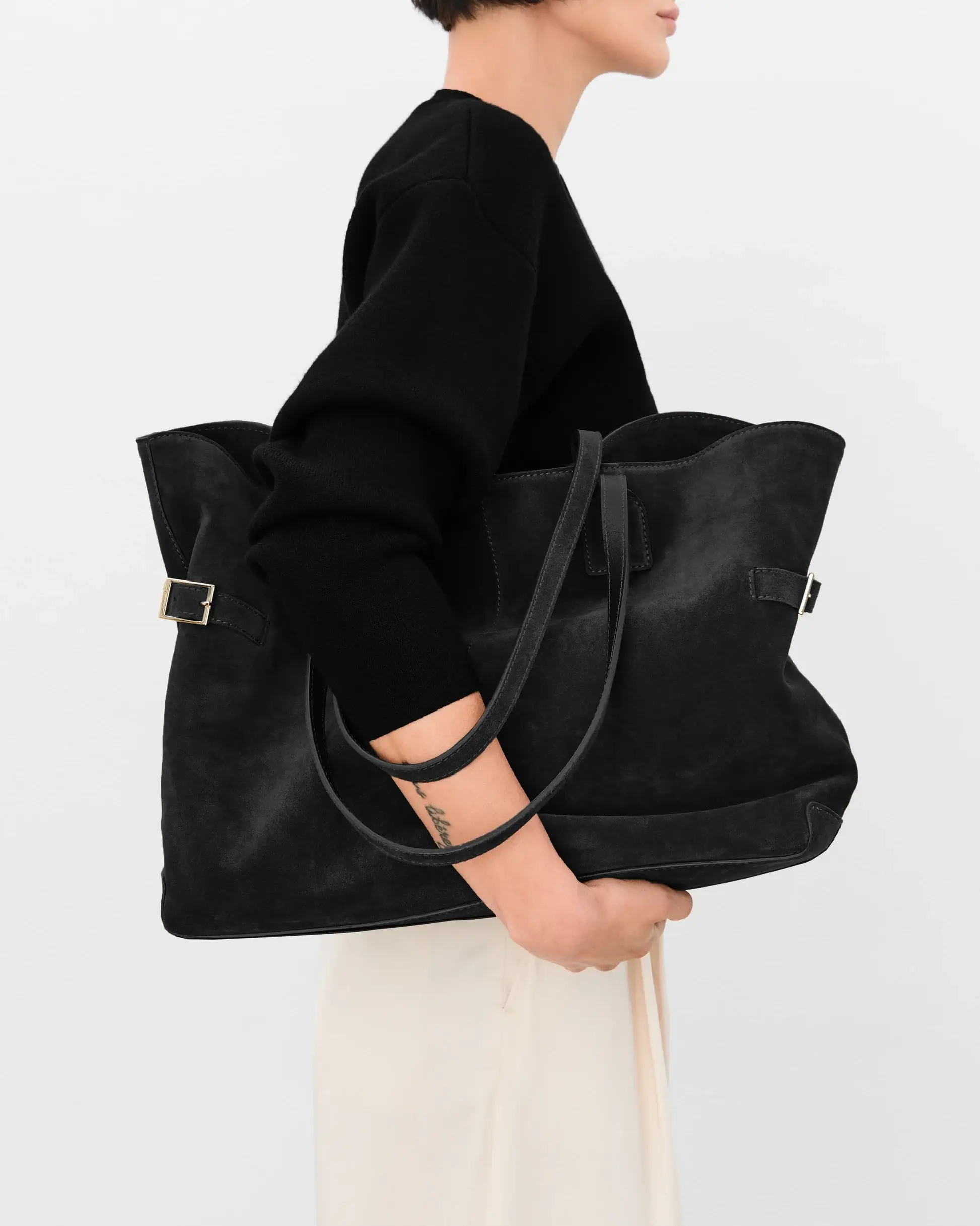 Flattered black suede tote bag