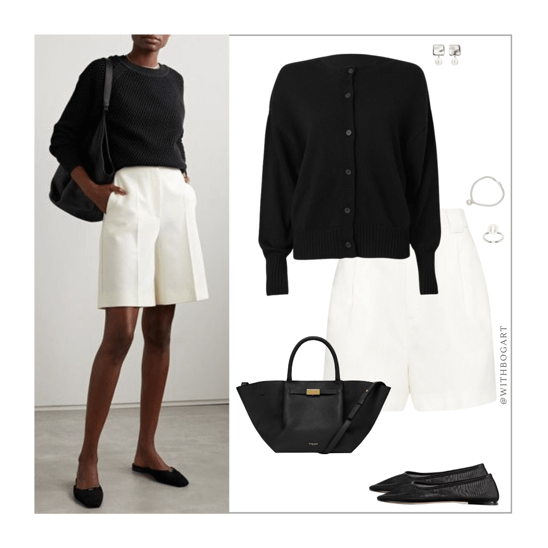 Woman wearing black cardigan, white tailored shorts, black ballet flats
