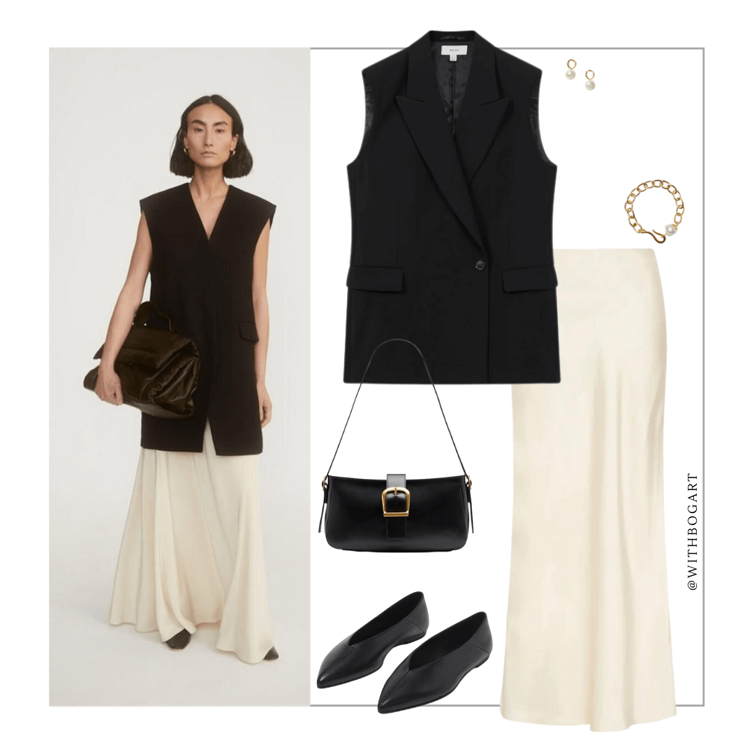 Woman wearing longline waistcoat vest, slip skirt and black flats