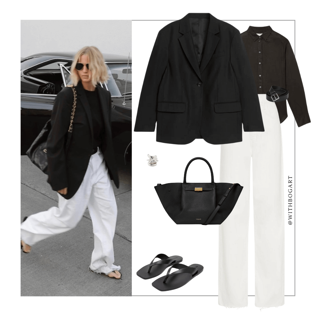 Woman wearing black blazer, shirt, white jeans and black sandals