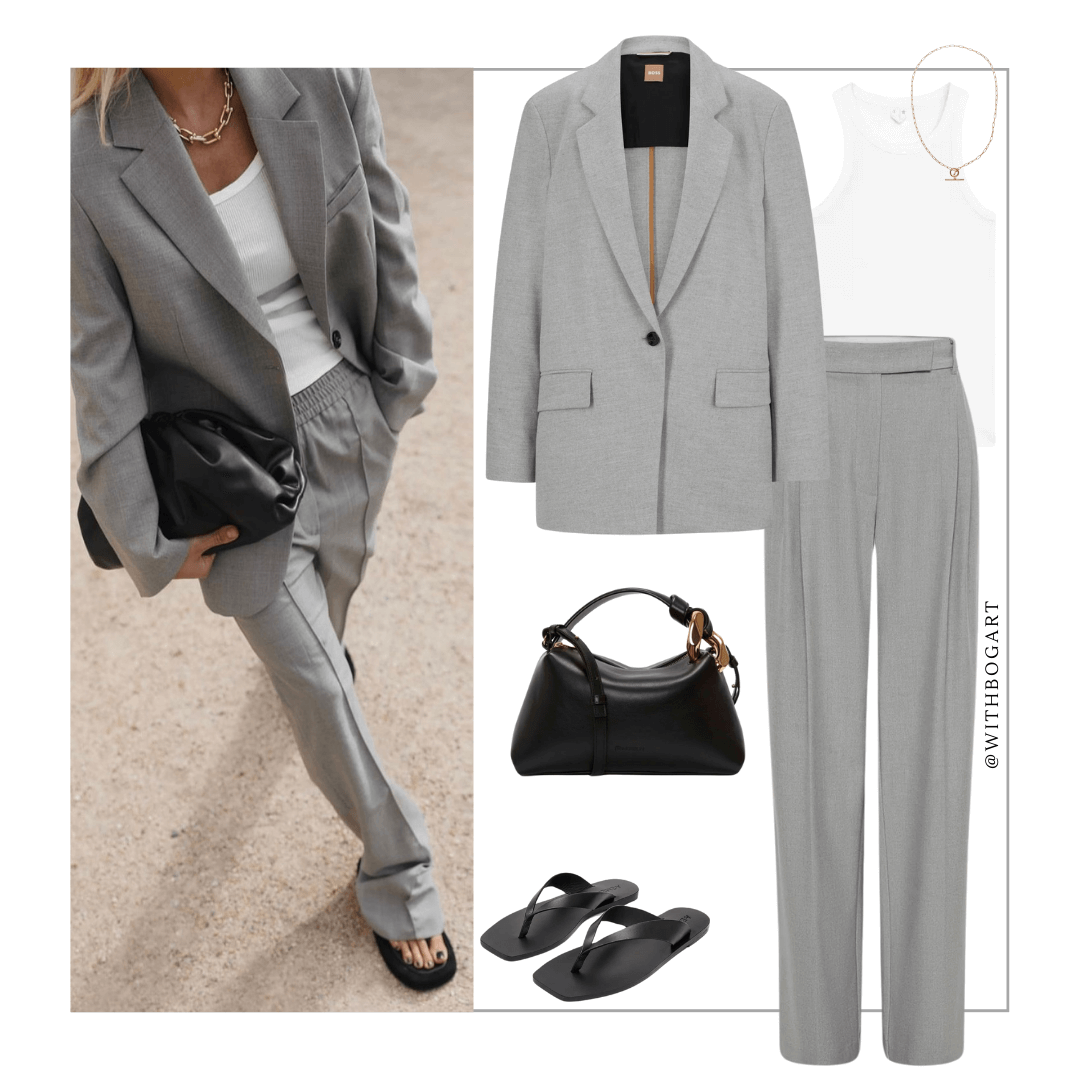 Woman wearing grey blazer, white singlet, grey pants and sandals