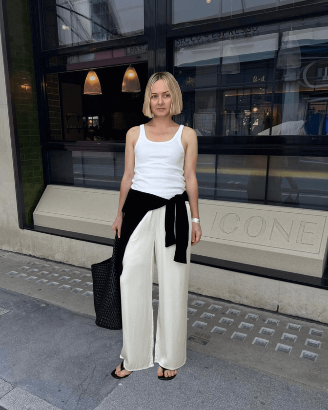 woman wearing white tank top with cream silk pants