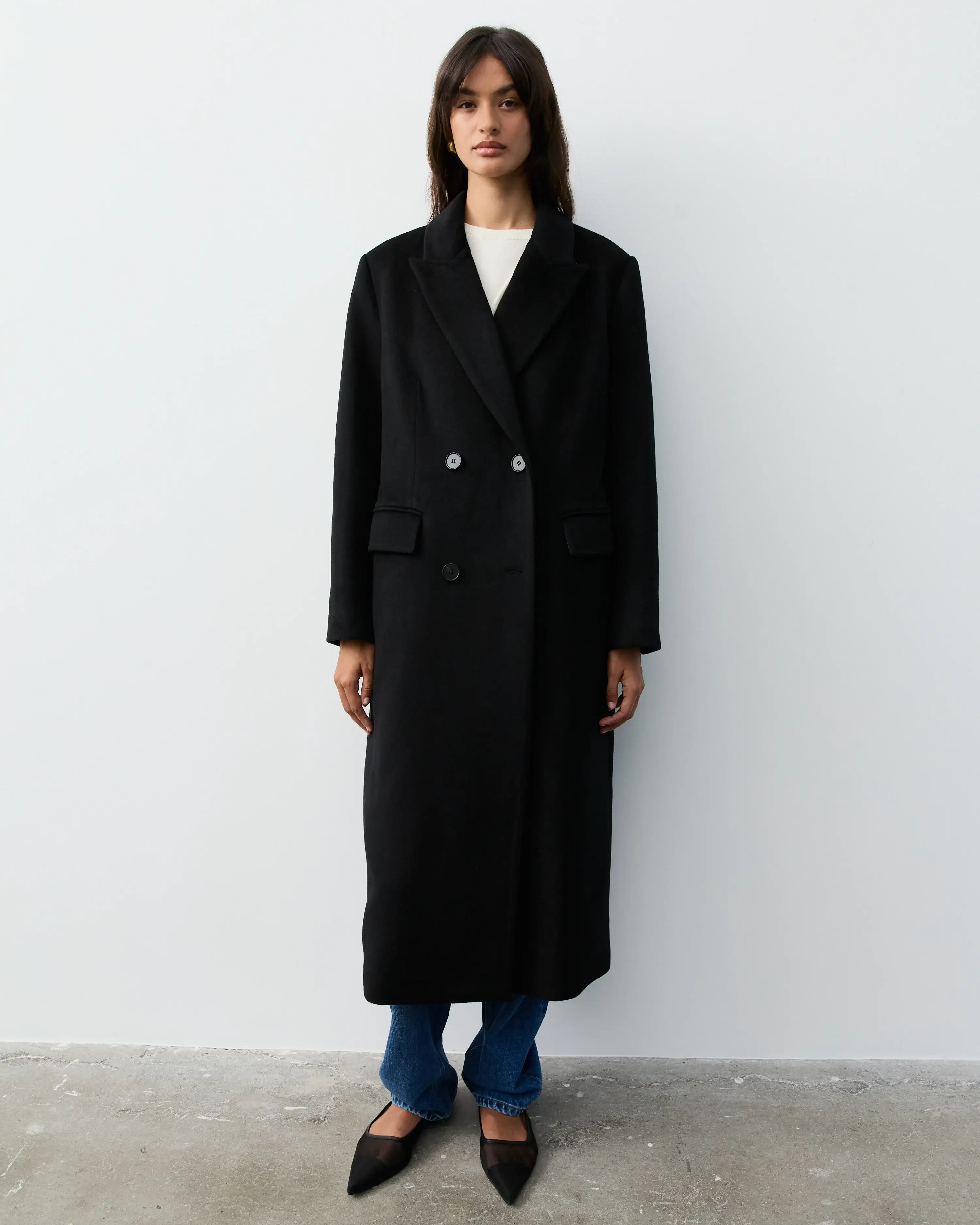 The Curated black coat