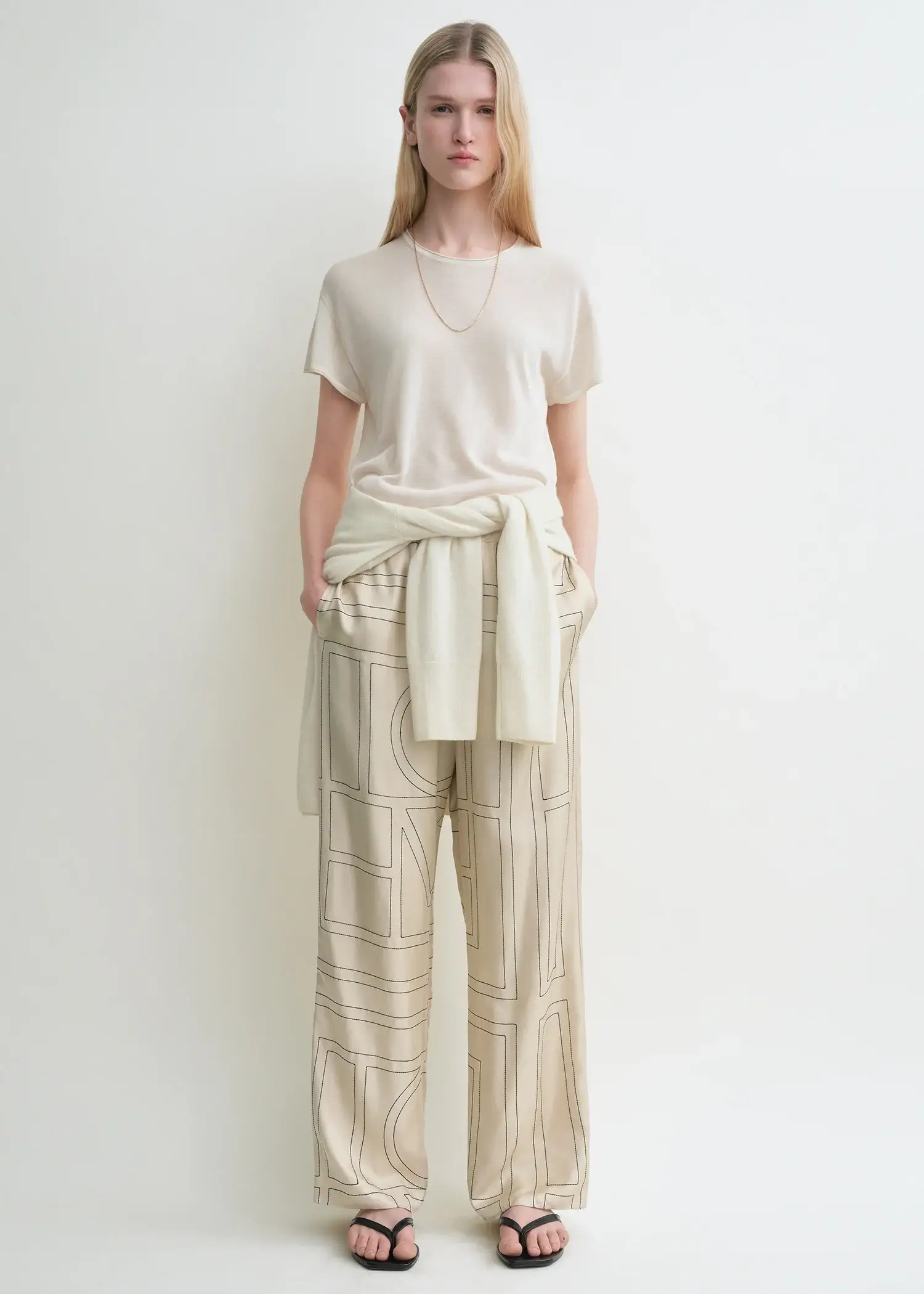 Toteme cream monogram silk pants